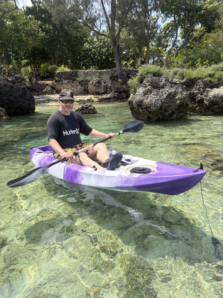 Kayaking in the sheltered reef pool at Coral Sunset